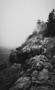 Bass Harbor Head Light is a historic lighthouse located within Acadia National Park in Bass Harbor, Downeast Maine. This iconic lighthouse sits perched on rugged cliffs overlooking the Atlantic Ocean, offering breathtaking views and a picturesque setting that attracts photographers and visitors year-round. The lighthouse was constructed in 1858 and continues to serve as an active aid to navigation, guiding mariners along the Maine coast. Surrounded by natural beauty, Bass Harbor Head Light is a quintessential symbol of Maine's maritime heritage and is renowned for its striking presence, especially when shrouded in the region's characteristic fog.