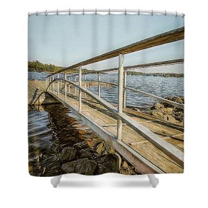 This artistic photograph captures the gangway leading down to the dock in Blue Hill Bay, located in Blue Hill, Maine. The image is rendered with a painterly effect, enhancing the textures and colors of the wooden gangway, the surrounding rocks, and the calm waters of the bay. The perspective of the gangway creates a sense of depth, inviting the viewer to step into the scene and experience the tranquility of the coastal setting. Add a touch of serene coastal charm to your bathroom with our To the Bay Shower Curtain. This beautifully composed photograph by Blaine Stoner features a wooden bridge leading down to the calm waters of Blue Hill Bay, inviting a sense of peace and tranquility into your home. The warm tones and gentle waves create a soothing atmosphere, making this shower curtain a perfect complement to any bathroom decor.  Key Features: High-quality fabric: Made from 100% polyester, this shower curtain is durable, water-resistant, and designed to last. Crisp, fade-resistant print: The detailed photography is printed with precision, ensuring that the natural textures and colors remain vibrant over time. Generous size: Measuring 71" x 74", it provides full coverage for standard showers and bathtubs. Easy installation: Comes with 12 reinforced hook holes, making it simple to hang with your favorite shower curtain hooks. Machine washable: Easy to care for, this shower curtain is machine washable, allowing for hassle-free maintenance. Perfect for any bathroom:  Home decor: Bring the calm and beauty of a seaside retreat into your bathroom with this unique and artistic shower curtain. Gifting: This shower curtain makes a thoughtful gift for those who appreciate nature, photography, and coastal decor. Transform your bathroom into a peaceful coastal getaway with the To the Bay Shower Curtain. Photography by Blaine Stoner.