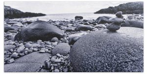 Experience the rugged beauty of the coast with the "After the Storm" towel, showcasing a powerful photograph by Blaine Stoner. This image captures the raw and natural beauty of a rocky shoreline, where stones and pebbles have settled after the tumultuous energy of a storm. The monochrome tones emphasize the textures and contrasts, making this towel a striking piece of art for your home or beach outings. Key Features: Premium Fabric: Crafted from soft, absorbent material that is perfect for drying off after a swim or a shower. Detailed Print: The high-resolution print brings out the intricate details of the rocks, providing a tactile and visual experience. Versatile Size: Ideal for use as a beach towel, bath towel, or a unique decorative accent. Easy Maintenance: Machine washable for hassle-free care and long-lasting quality. Perfect For: Nature Enthusiasts: Bring the rugged charm of the coast into your daily routine with this artistically captured towel. Gifting: An excellent gift for those who appreciate the power and beauty of nature, coastal landscapes, and fine art photography.