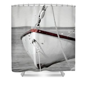 A Fine Art shower curtain featuring the lifeboat of the historic schooner Margaret Todd, suspended over the calm waters of Bar Harbor, Maine.