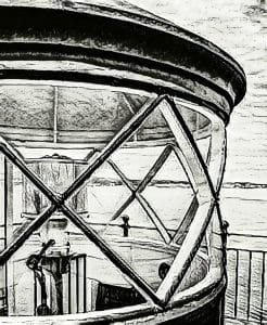 This artistic photograph captures the Rockland Breakwater Lighthouse in Rockland, Maine, transformed into a pencil drawing effect. The image focuses on the intricate design of the lighthouse's lantern room window, framing a view of the surrounding coastal scenery. The black and white treatment emphasizes the structural details and textures, creating a timeless, nostalgic atmosphere. This creative rendering showcases the beauty and historical significance of the lighthouse in a unique, illustrative style.