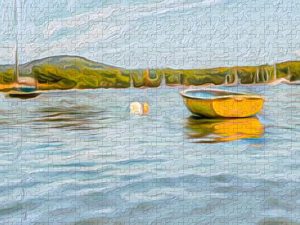 Painterly photograph of a yellow boat on calm waters, with distant sailboats and green hills, captured by Blaine Stoner.