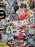 A heavily stickered blue US Postal Service mailbox on a street in Bar Harbor, Maine, covered in a dense mosaic of colorful stickers from local businesses, music bands, and events.